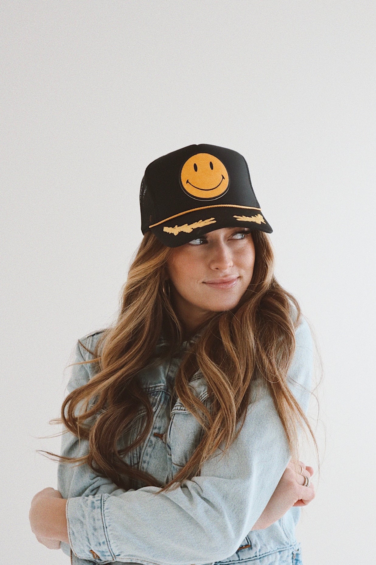 Smiley Yellow Leather On Black and Gold Leaf Trucker Hat