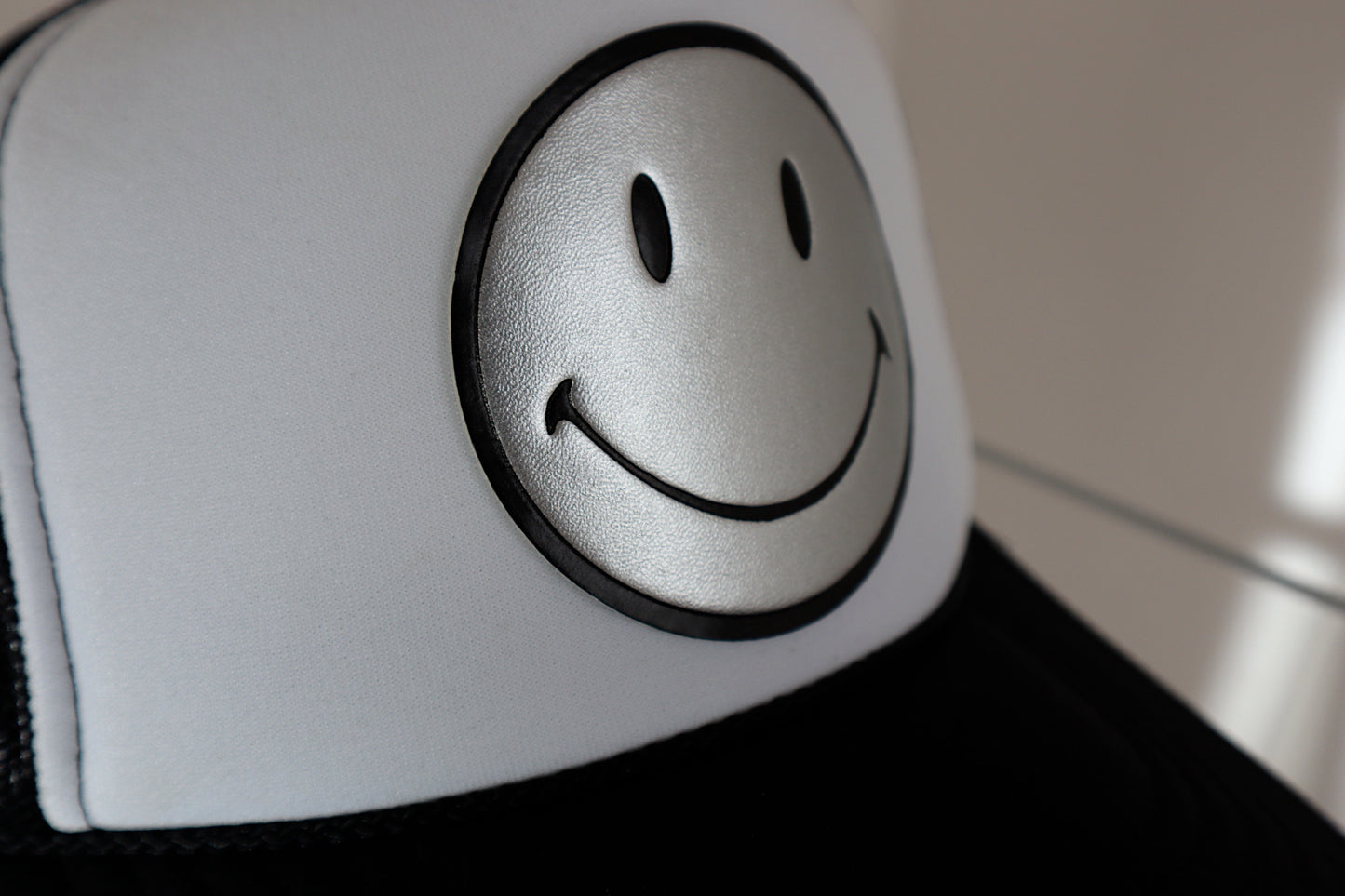 Silver Leather Smiley on Black and White Trucker Hat