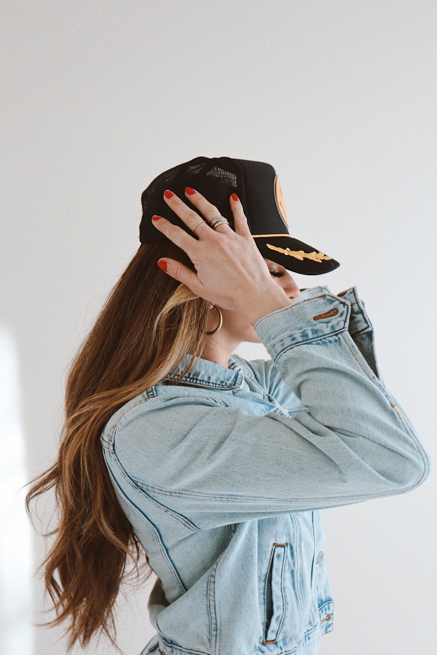 Smiley Yellow Leather On Black and Gold Leaf Trucker Hat