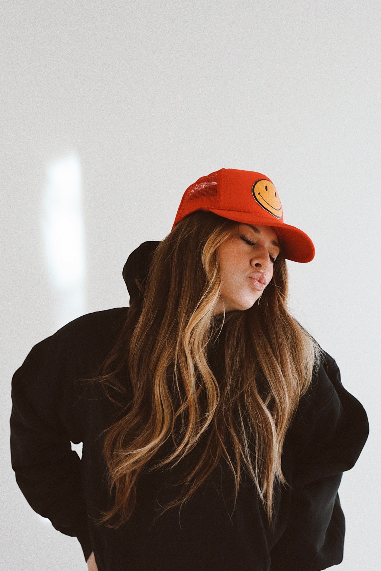 Smiley Yellow Leather on Red Trucker Hat