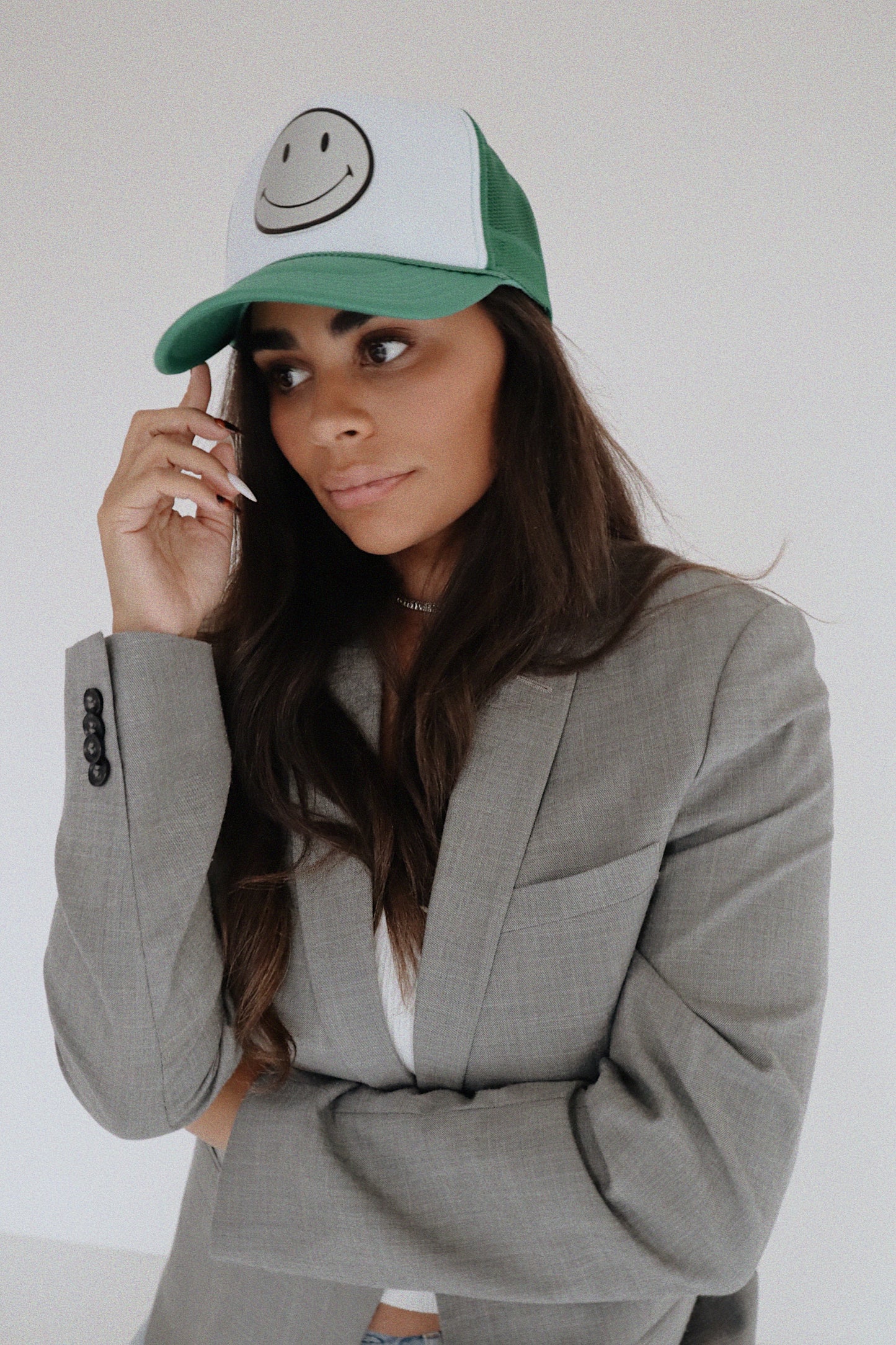 Silver Leather Smiley on Green and White Trucker Hat