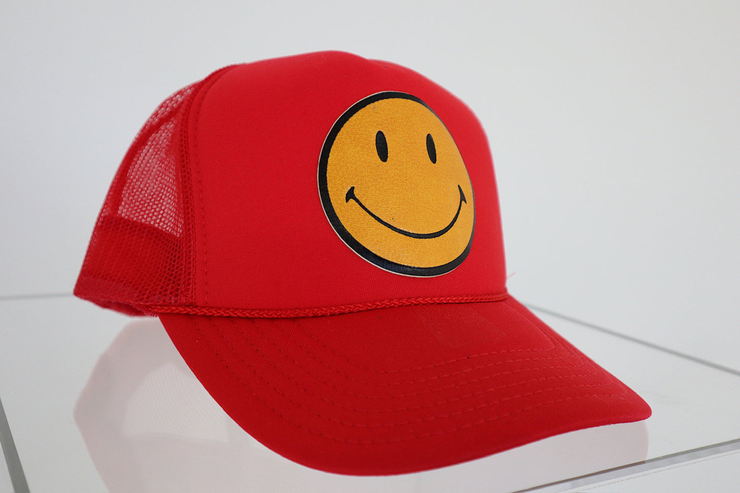 Smiley Yellow Leather on Red Trucker Hat